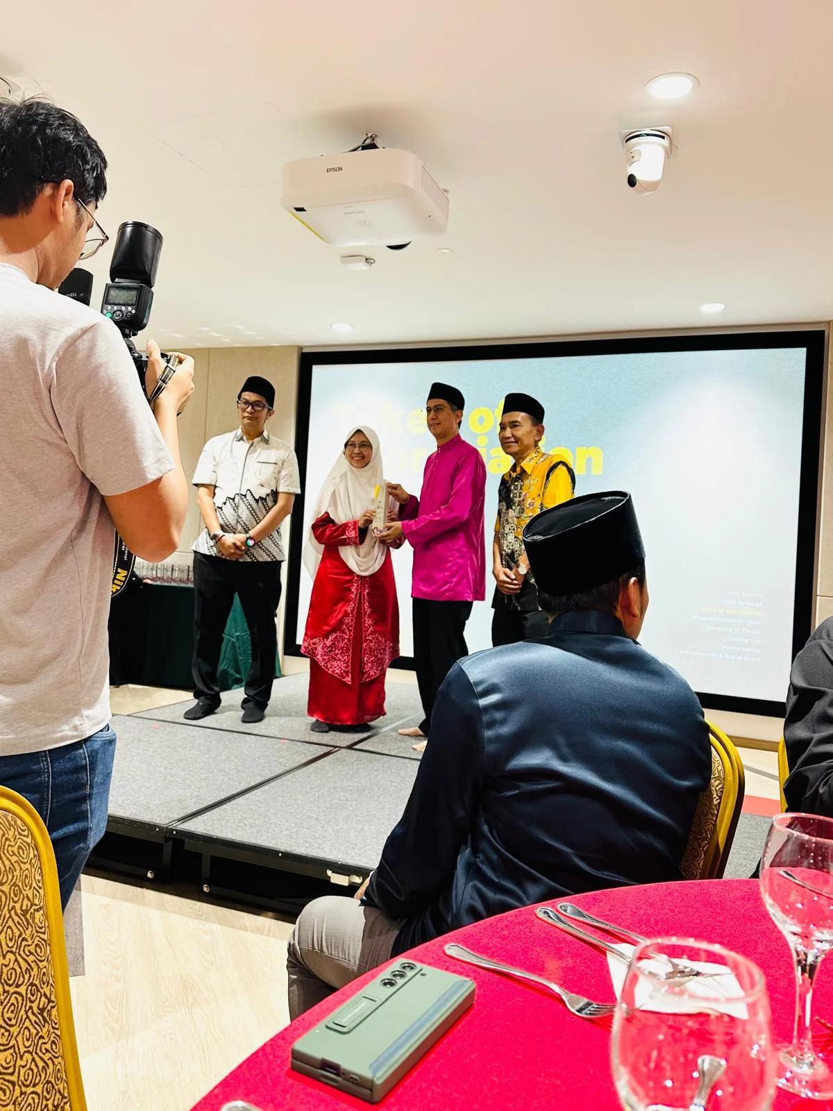 Token of appreciation presented on stage during the mosque appreciation ceremony