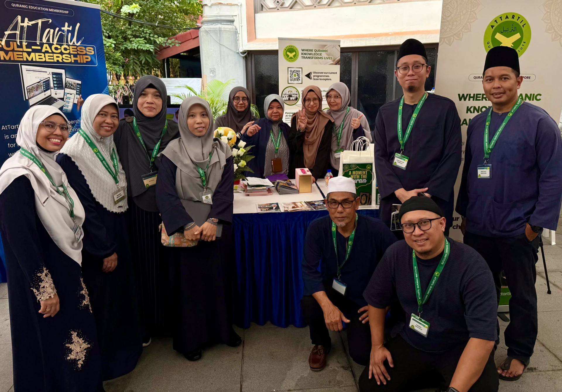 The AtTartil QI team gathered together at the Day 2 booth