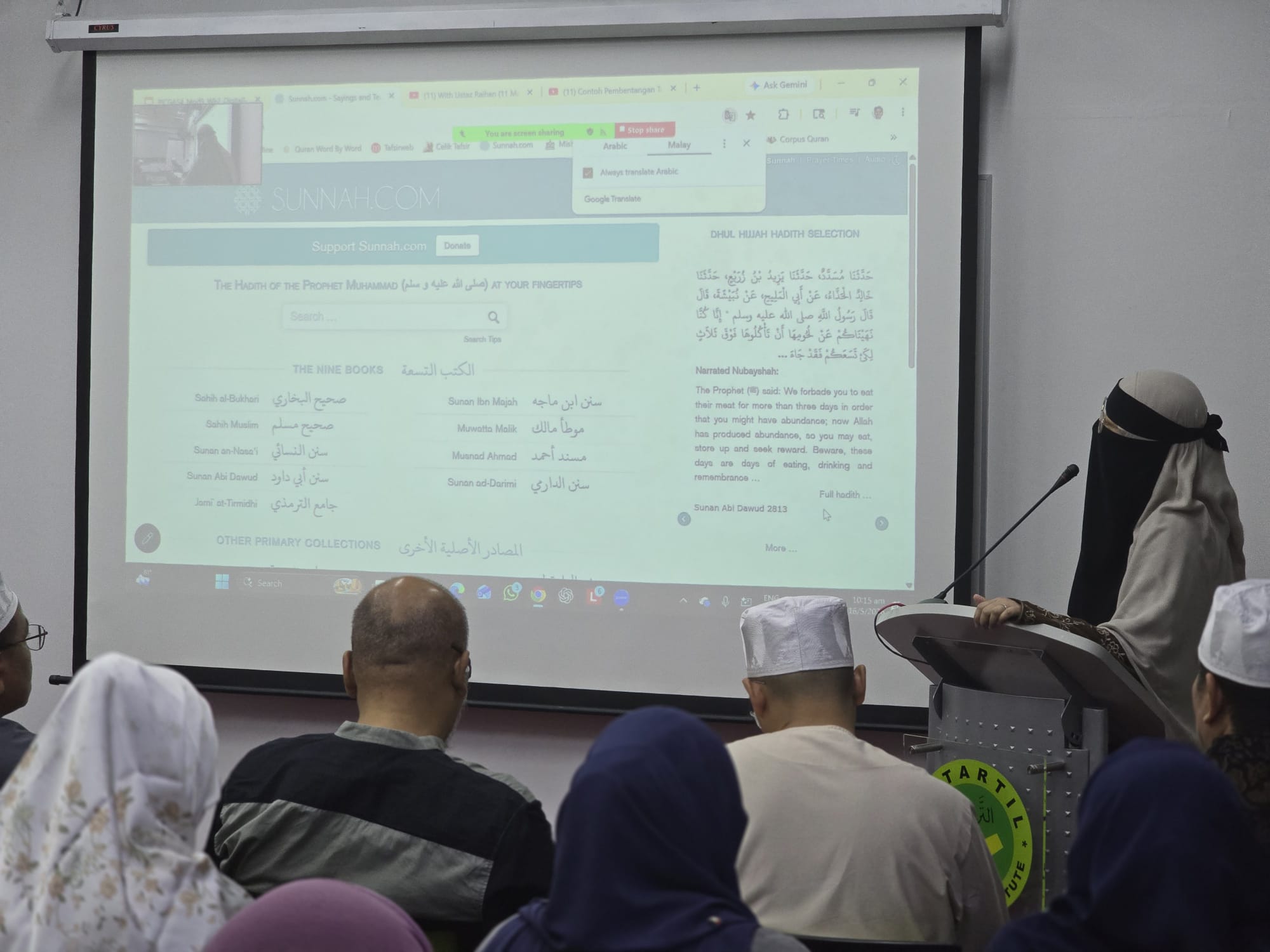 Graduating students of the QLME programme at AtTartil Quranic Institute holding their certificates during the batch 14–17 ceremony